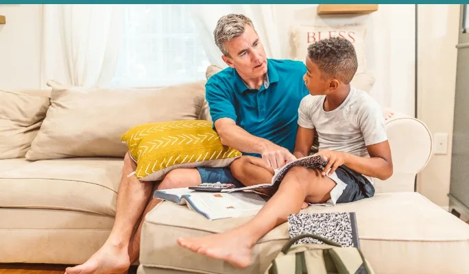 Parent and child having a supportive conversation at home