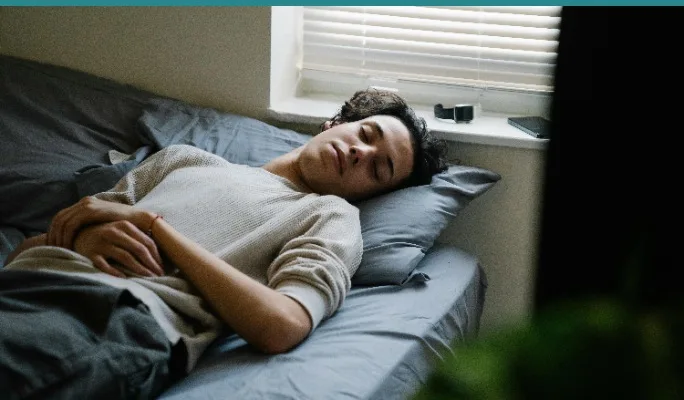 Teen sleeping in bed late into the morning